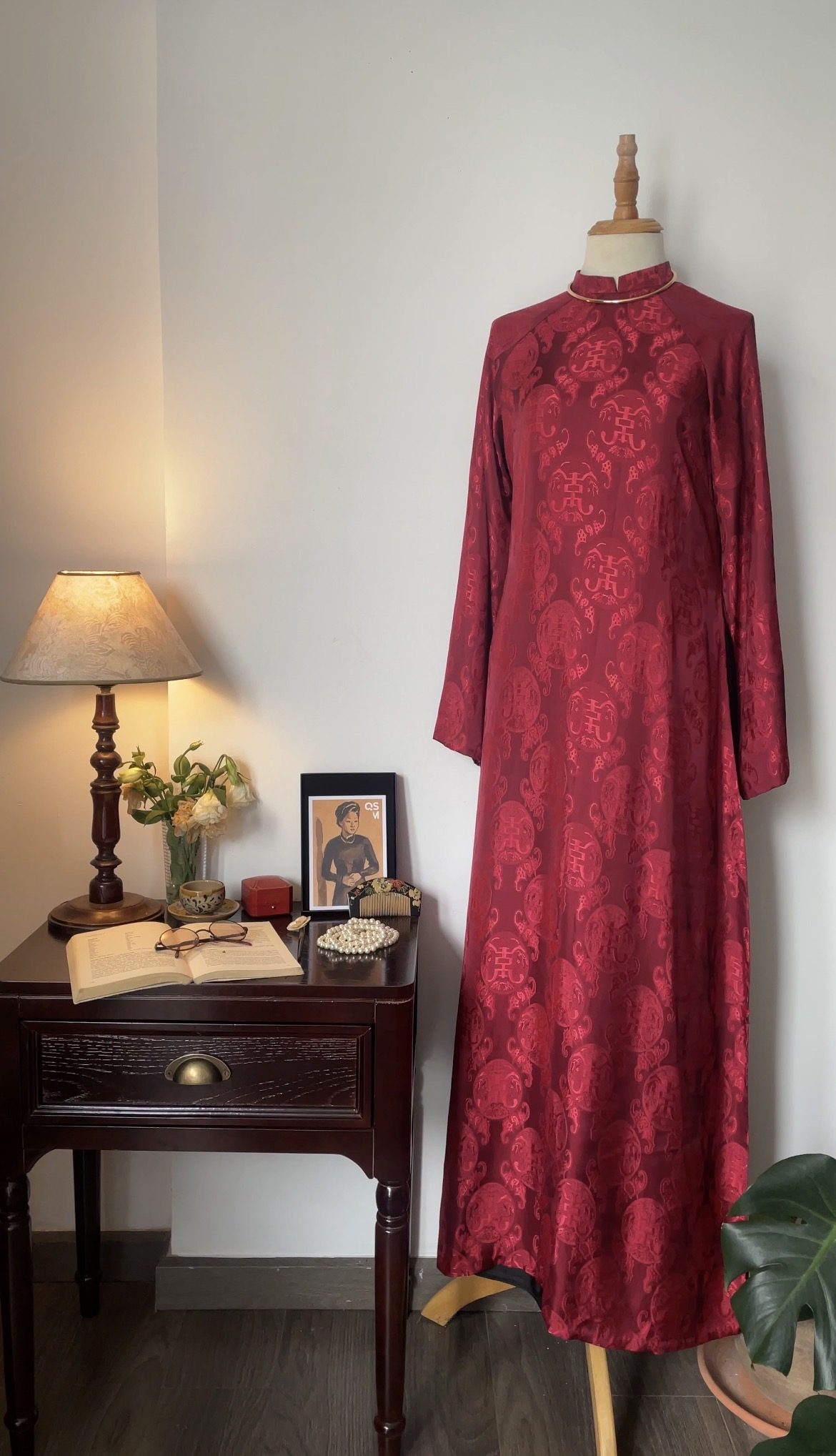 A one-of-a-kind TRAN-DO ao dai in red brocade silk, ready to wear
